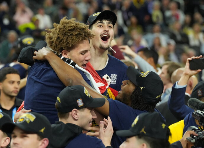 Mičigano universitetas triumfuoja NCAA po ilgų metų pertraukos (Scanpix nuotr.)