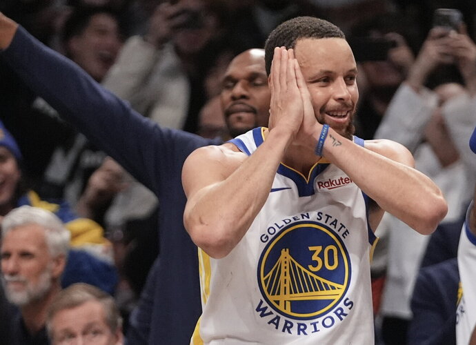 S.Curry žibėjo ryškiai (Scanpix nuotr.)